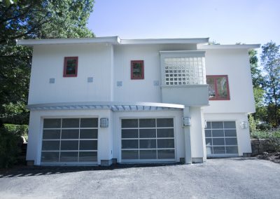 Exterior Wide shot of Side of house with Garages